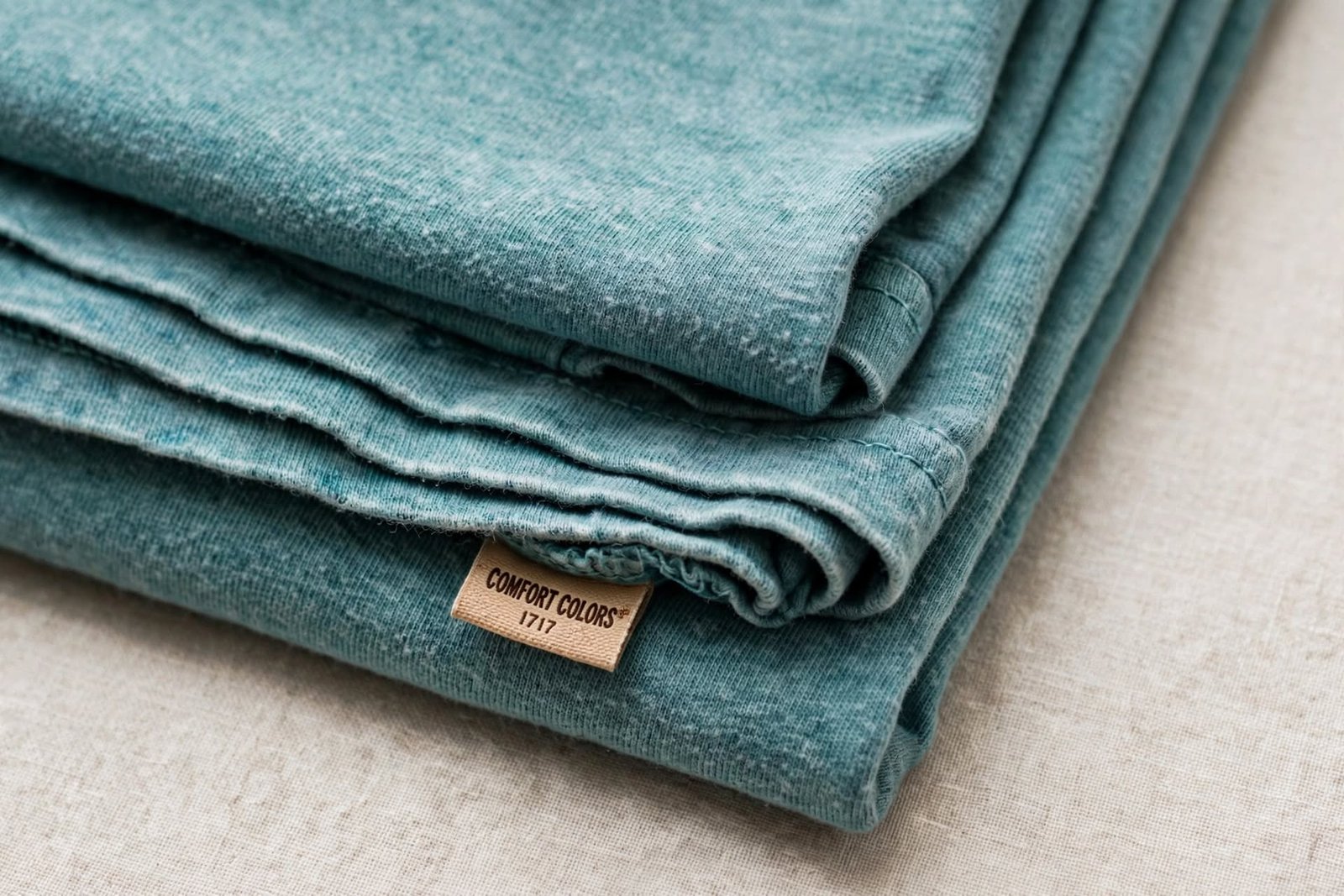 faded teal fabric macro